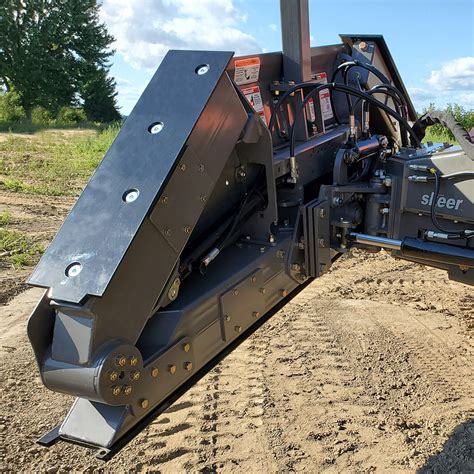 grading with a wheeled skid steer|grading blade for skid steer.